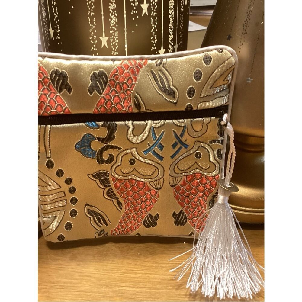 NWT. Gold Embroidered Fish Tassel Wristlet Clutch
